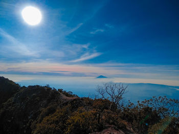 Scenic view of mountains against blue sky