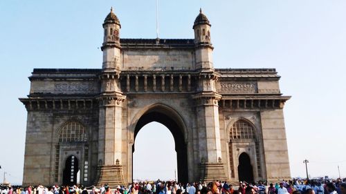 Group of people in front of historical building