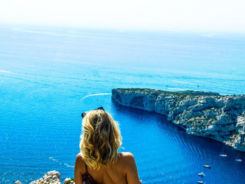 Rear view of woman looking at sea