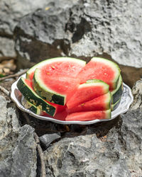 High angle view of strawberries on rock