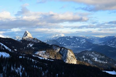 Scenic view of snowcapped mountains against sky