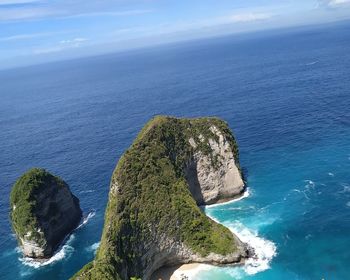 High angle view of rocks in sea against sky