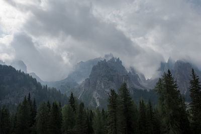 Scenic view of mountains against cloudy sky