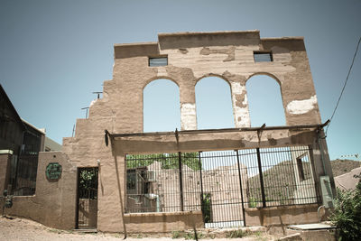 Low angle view of old building against clear sky