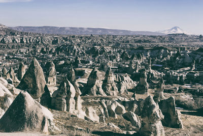 Aerial view of landscape with mountain range in background