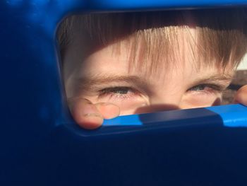 Close-up of boy seen through gape