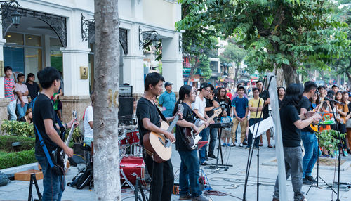 People standing on street in city