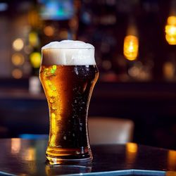 Close-up of beer glass on table