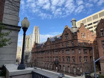 Low angle view of buildings against sky in city