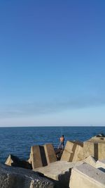 Scenic view of sea against clear blue sky