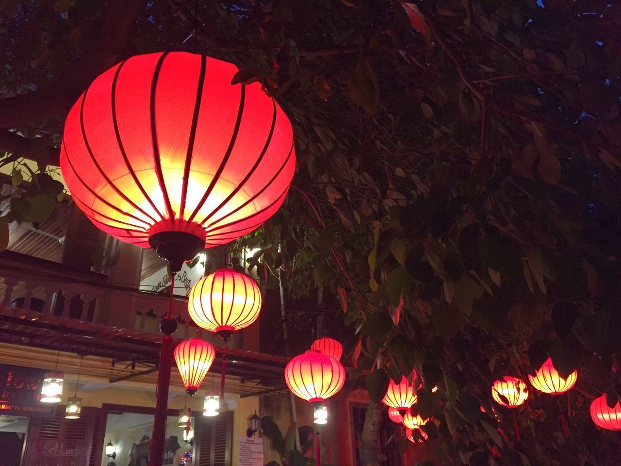 LOW ANGLE VIEW OF ILLUMINATED LANTERN