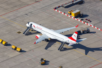 High angle view of airplane on airport runway