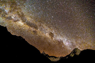 Low angle view of stars in sky at night