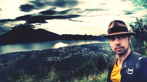 Portrait of man in mountains against sky