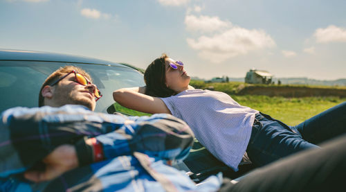 People in sunglasses against sky