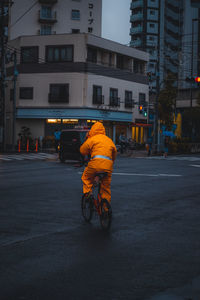 Man riding motorcycle on city street