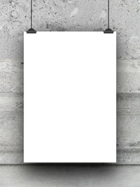 Close-up of paper hanging on wall