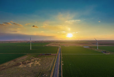 Scenic view of field against sky during sunset