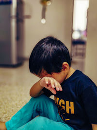 Boy sitting at home