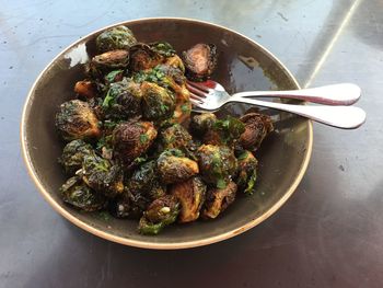 High angle view of caramalized brussel sprouts in bowl on table