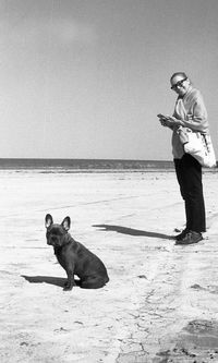 Man with dog on beach
