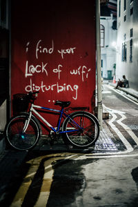 Bicycle sign on wet street