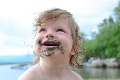 Close-up of baby girl with messy face