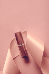 High angle view of lipstick on pink background