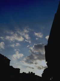 Low angle view of silhouette trees against sky at sunset