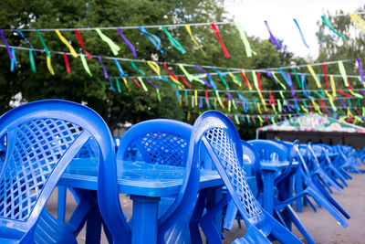 Close-up of empty chairs in park