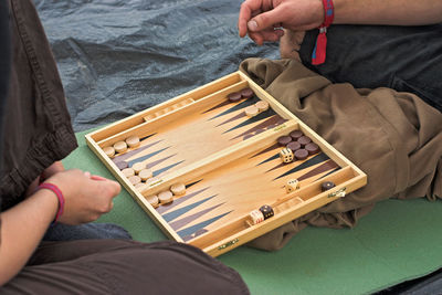 High angle view of friends playing board game