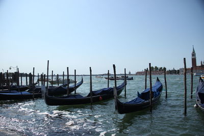 Boats in grand canal against clear sky