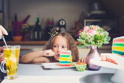 Portrait of girl eating cake