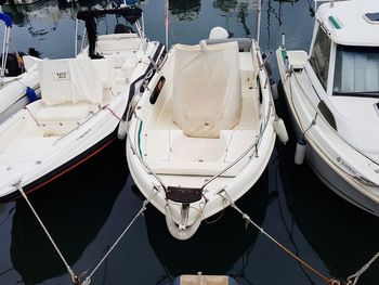 High angle view of sailboats moored at harbor