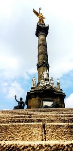 Low angle view of statue against sky