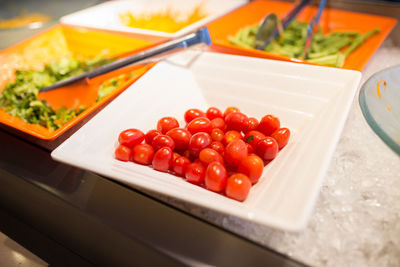 High angle view of fruits in plate on table