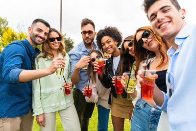 Friends enjoying in a drinking glass