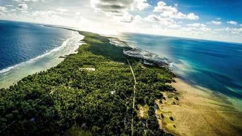 Scenic view of sea against cloudy sky