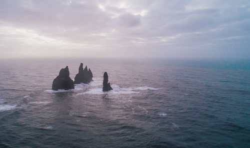 Scenic view of rock formation amidst sea