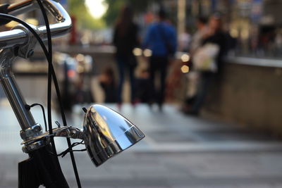 Cropped image of bicycle on street