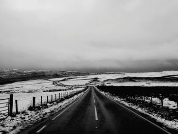 Road against sky during winter