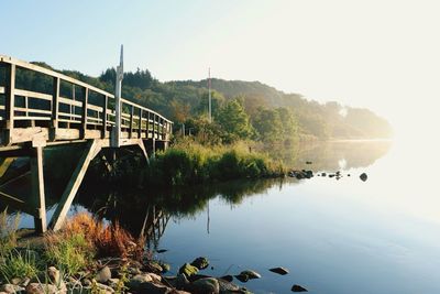 Bridge over river against clear sky