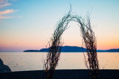 Close-up of sea against sky during sunset