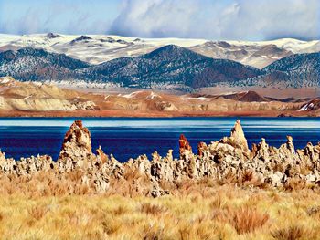 Scenic view of snowcapped mountains against sky