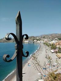 View of beach with city in background