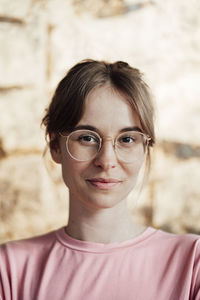 Woman with brown hair wearing eyeglasses