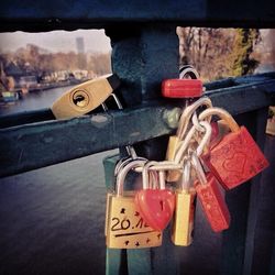 Close-up of padlocks on railing