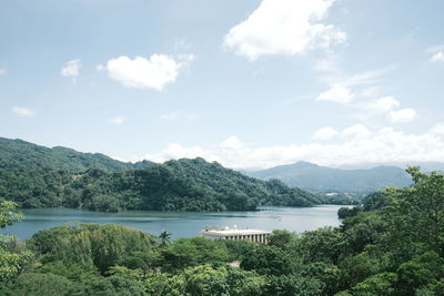 Scenic view of lake and mountains against sky