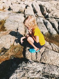 High angle view of woman on rock