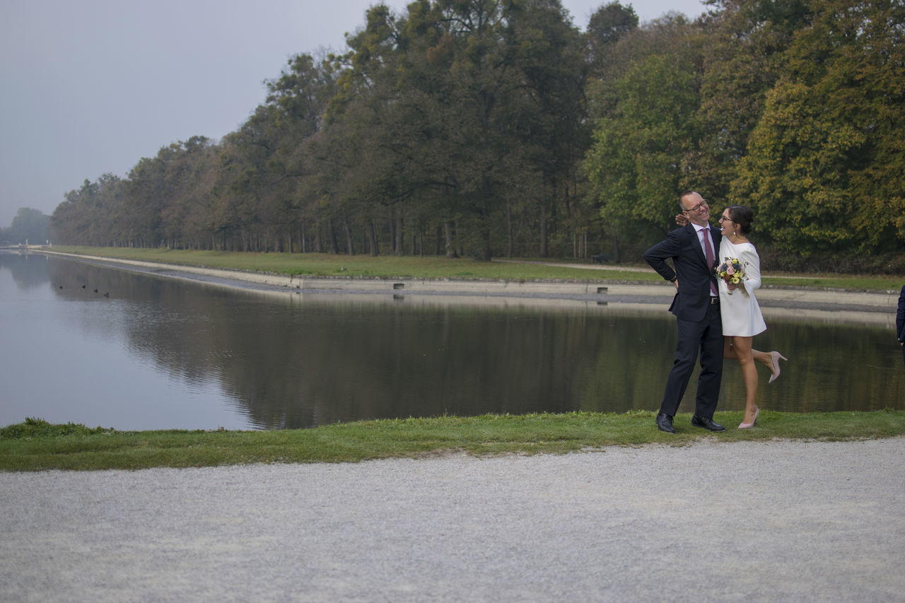 plant, full length, tree, real people, standing, water, nature, lake, day, leisure activity, lifestyles, growth, adult, men, beauty in nature, young adult, outdoors